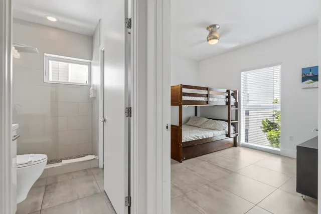 a bedroom with a bed and a lamp