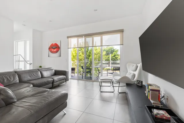a kitchen with stainless steel appliances granite countertop a sink refrigerator and cabinets