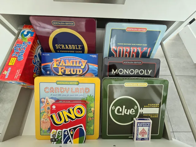a living room with kitchen island a table and chairs