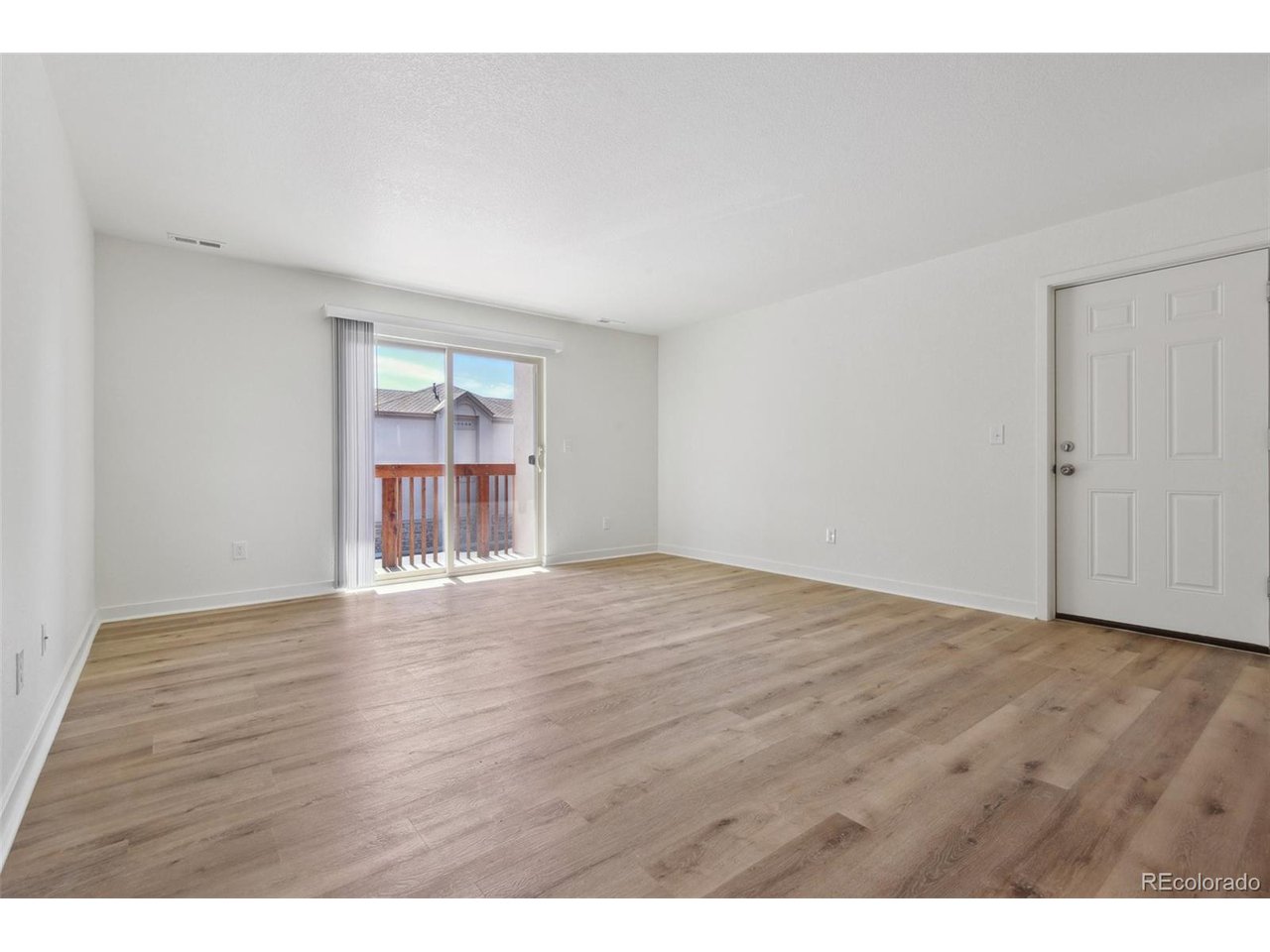 8457 South Reed Street, Unit 202 Littleton, CO 80128 - Photo 6 of 17 Living Room 2