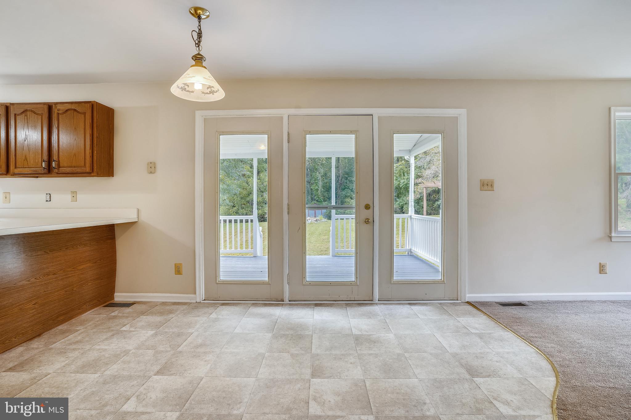16312 Quail Ridge Drive Rixeyville, VA 22737 - Photo 6 of 52 Brakfast area with doors to cover rear deck