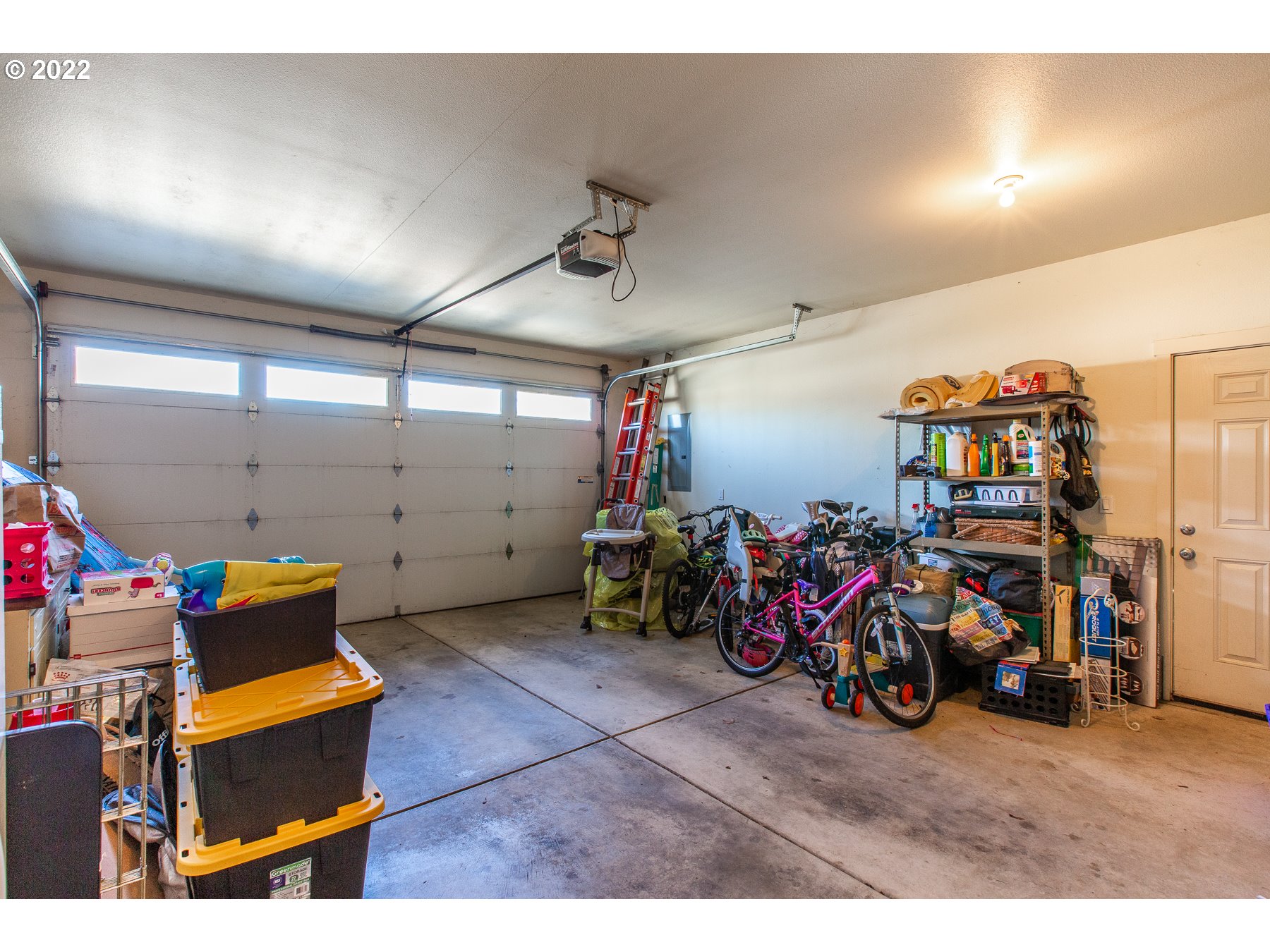 5363 I Street Springfield, OR 97478 - Photo 25 of 29 a view of a garage with a bike and car