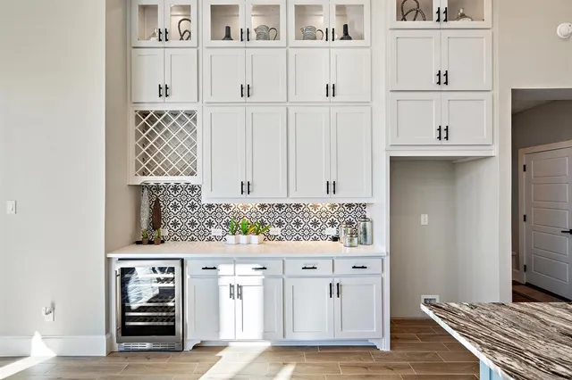 a view of cabinets with wooden floor