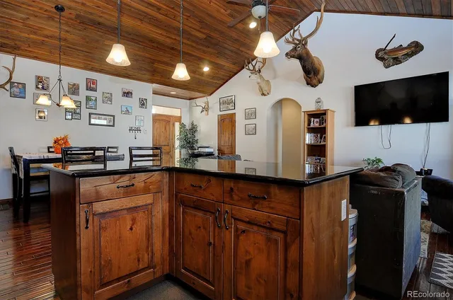 a kitchen with stainless steel appliances granite countertop a stove and a microwave