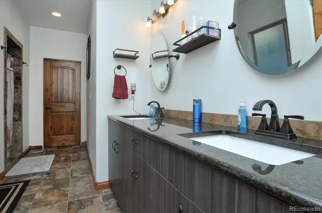 a bathroom with a sink and a mirror