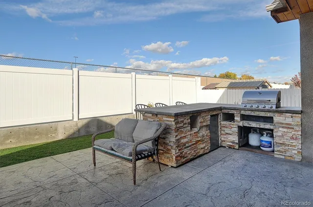 a living room with a table and chairs