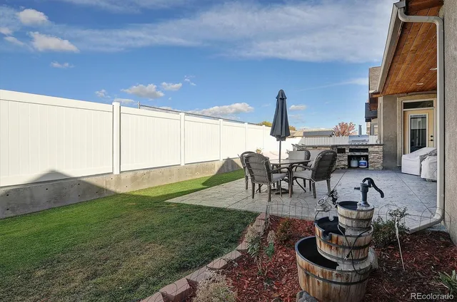 a table and chairs in the garden