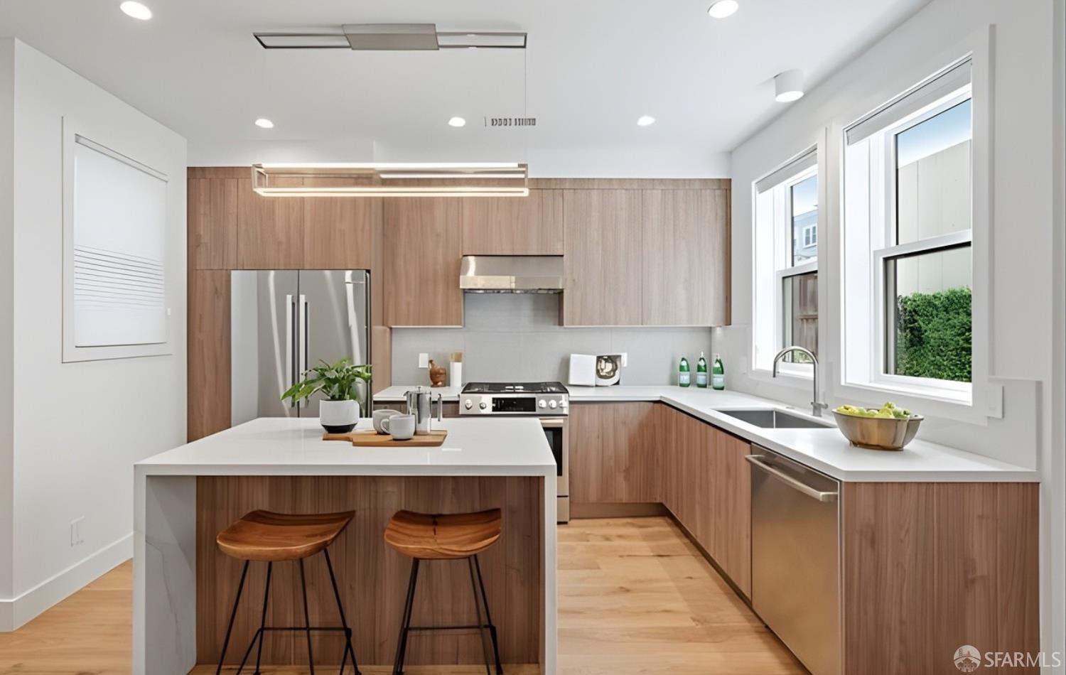 31-33 Prescott Court San Francisco, CA 94133 - Photo 12 of 56 a kitchen with a sink a window and chairs