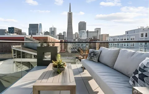 a view of roof deck with seating space and a potted plant