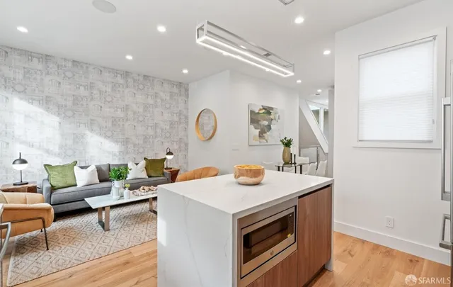 a view of entryway and gallery with wooden floor