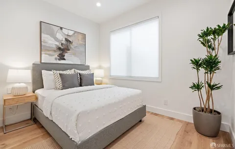 a bathroom with a sink a toilet a glass door shower and a mirror