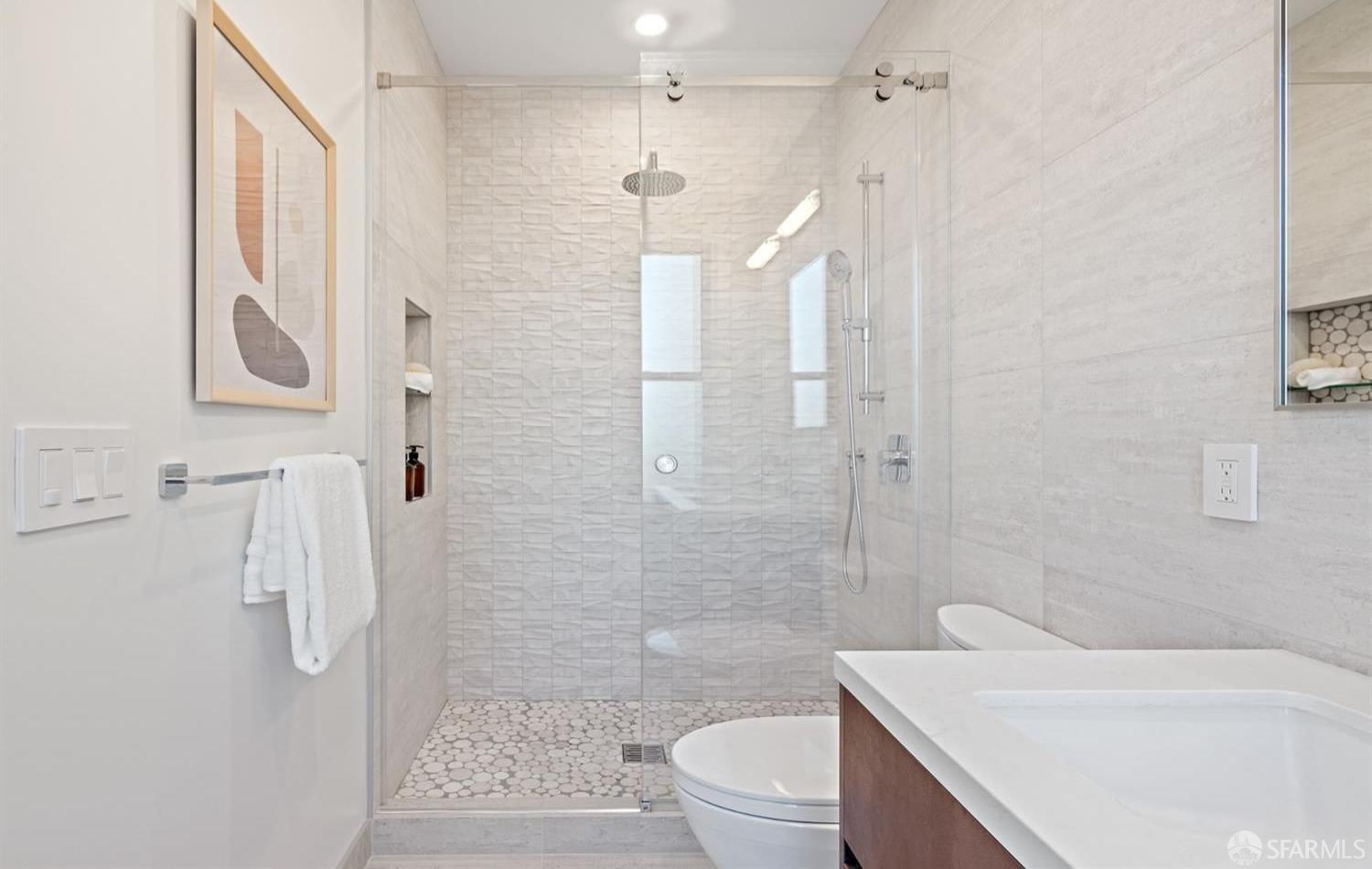 31-33 Prescott Court San Francisco, CA 94133 - Photo 33 of 56 a bathroom with a sink a toilet a glass door shower and a mirror