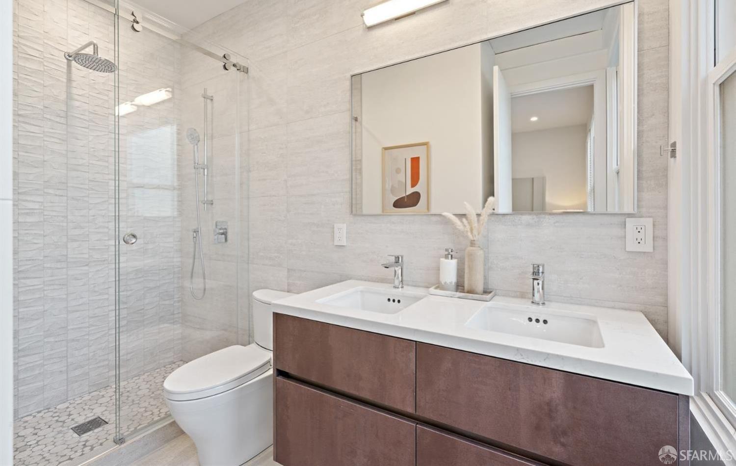 31-33 Prescott Court San Francisco, CA 94133 - Photo 35 of 56 a bathroom with a sink a toilet and shower