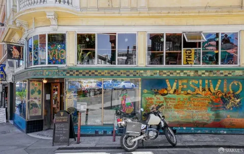 a view of a building with sitting area