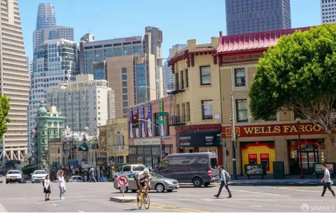 a front view of a building with parking area