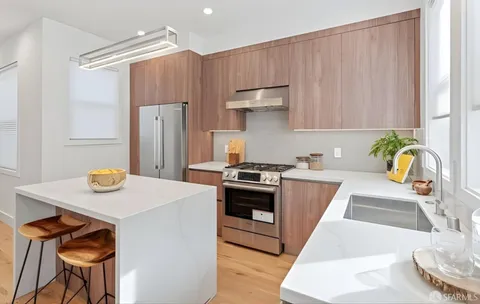 a kitchen with a table and chairs