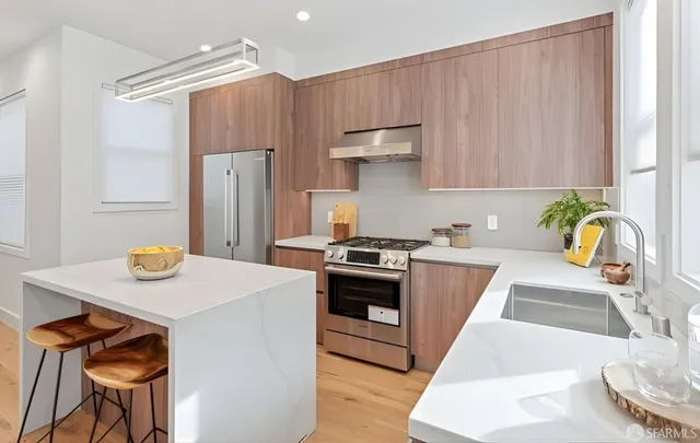 a kitchen with a table and chairs