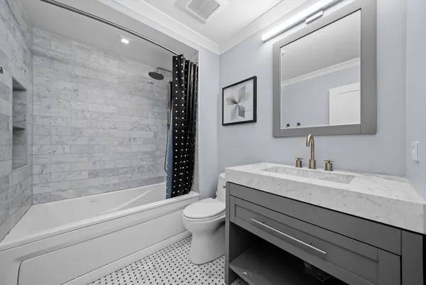 a bathroom with a sink a toilet and a bathtub