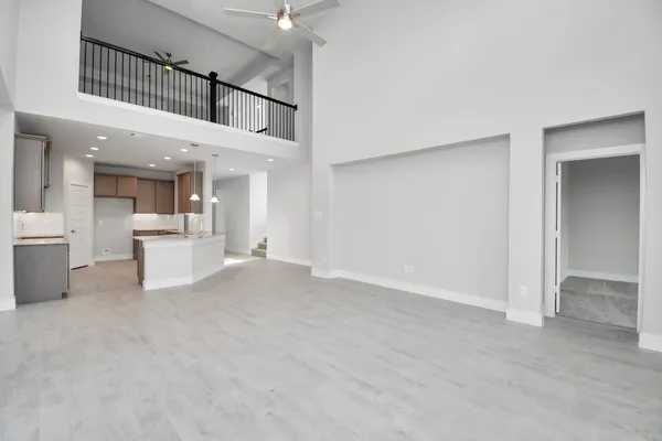 a view of a living room and kitchen with furniture and a fireplace