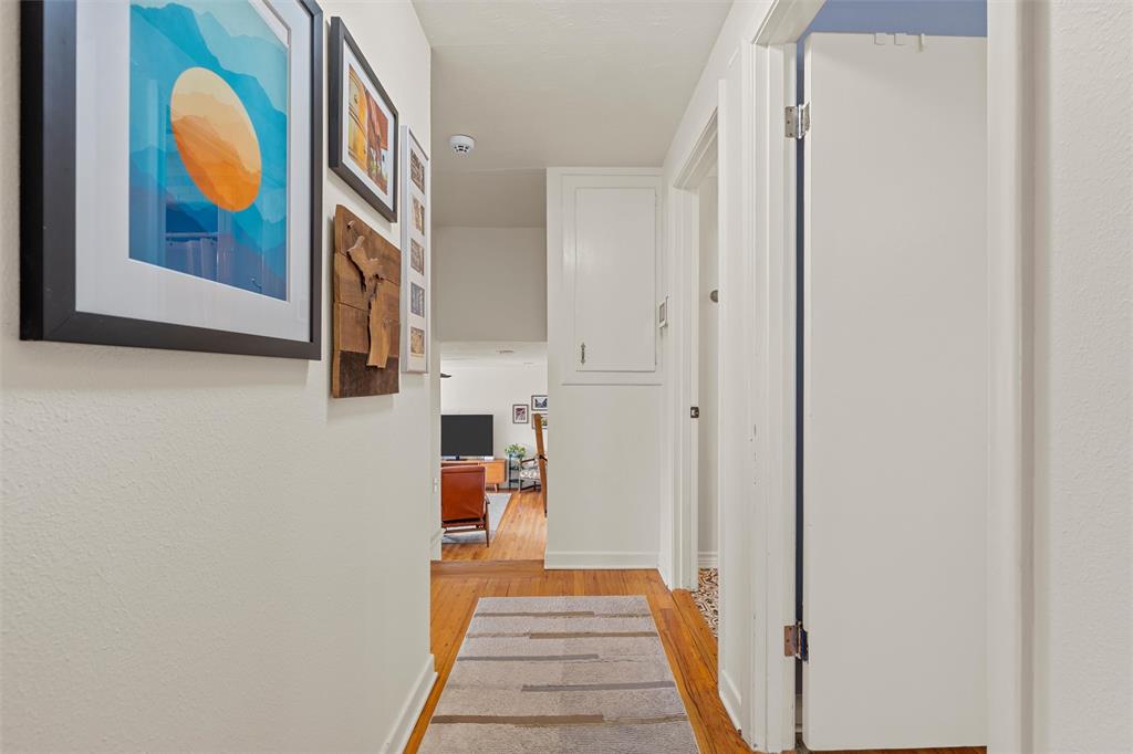 2216 Hermanson Drive Waco, TX 76710 - Photo 14 of 39 a view of a hallway with wooden floor and furniture
