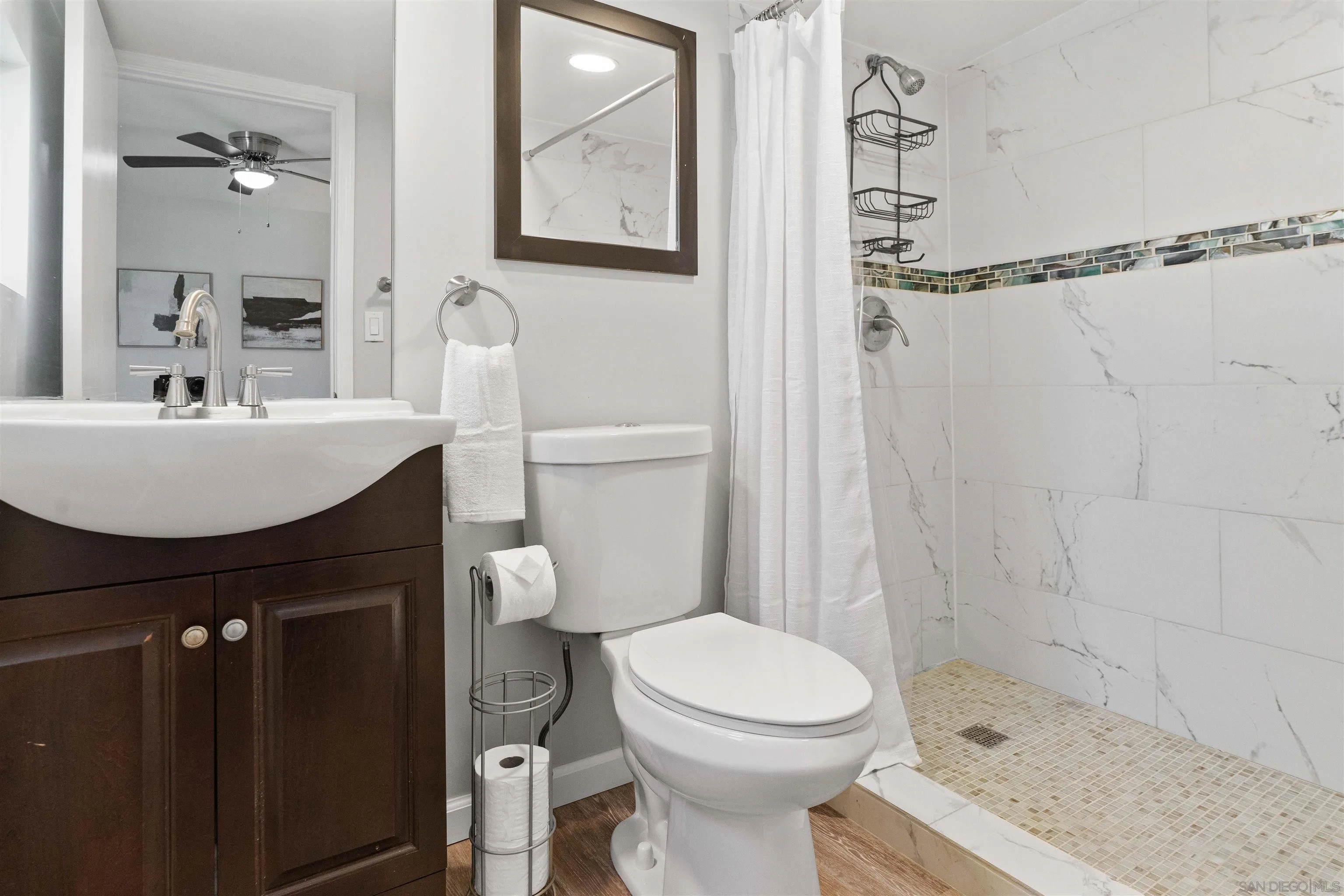 377 El Monte Road El Cajon, CA 92020 - Photo 11 of 16 a bathroom with a sink a toilet and shower