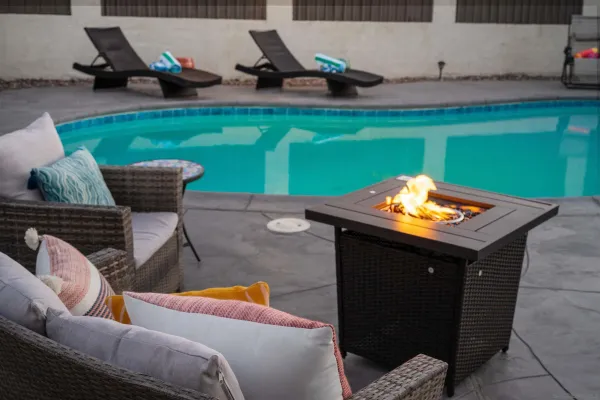 a view of a swimming pool with a table and chairs