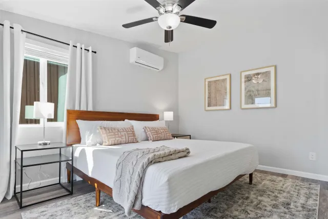 a bedroom with a bed and a window