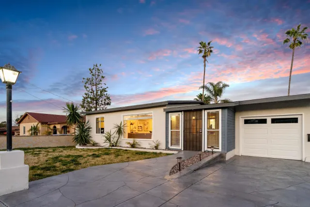 a view of house with outdoor space and garden