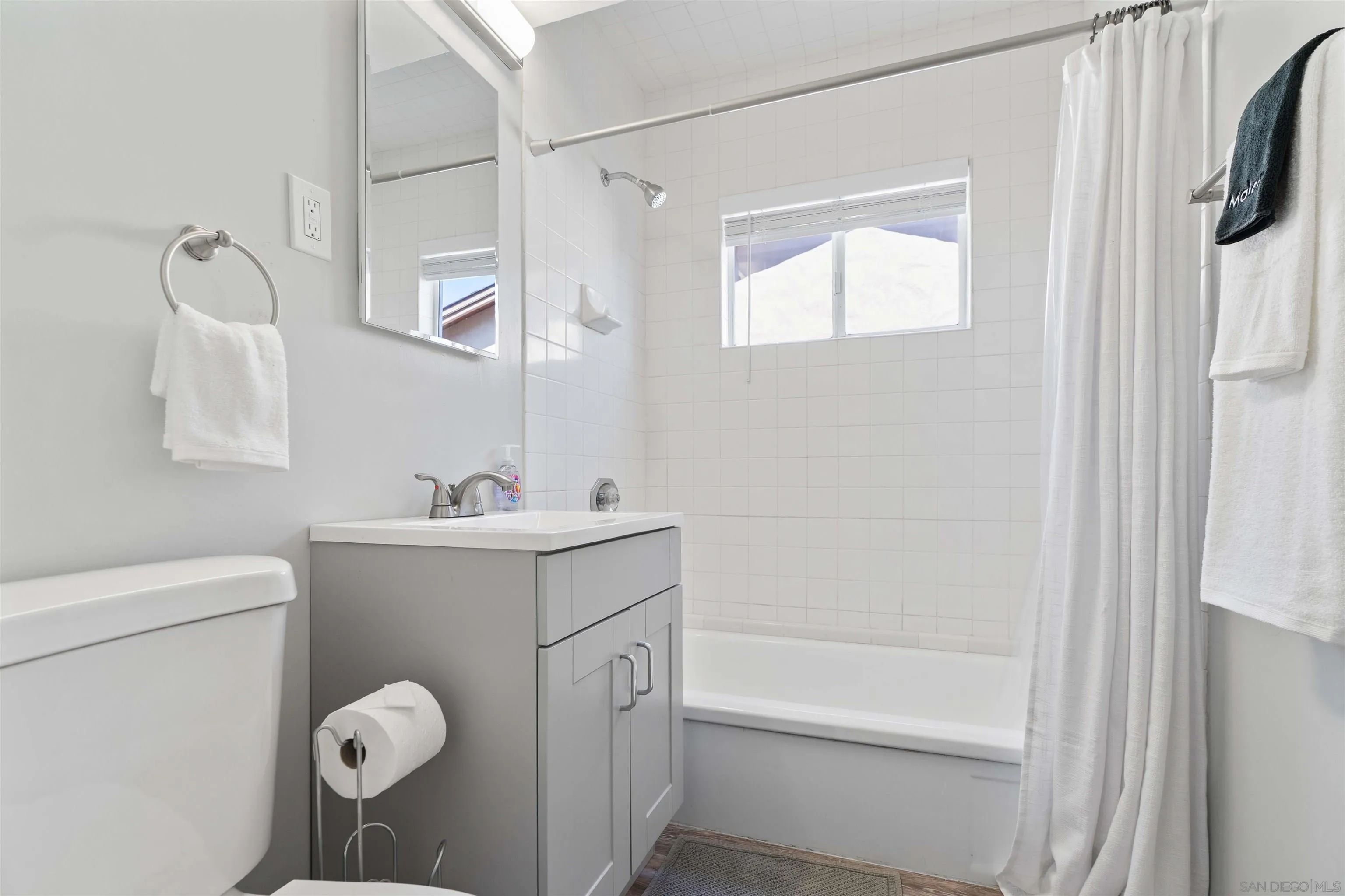 377 El Monte Road El Cajon, CA 92020 - Photo 6 of 16 a bathroom with a sink mirror vanity and toilet