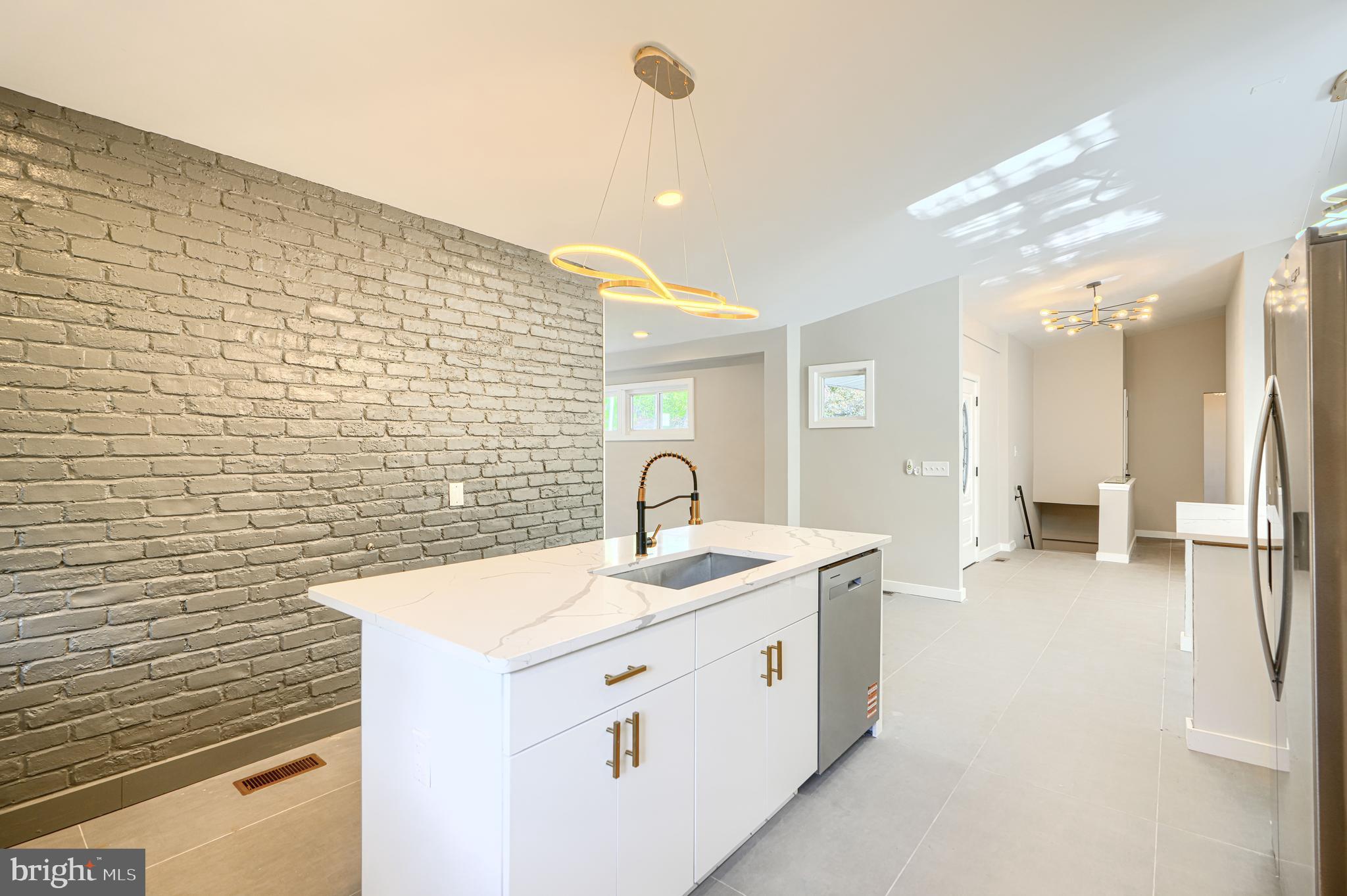 6200 Ivymount Road Baltimore, MD 21209 - Photo 19 of 71 a bathroom with a sink a mirror and a shower