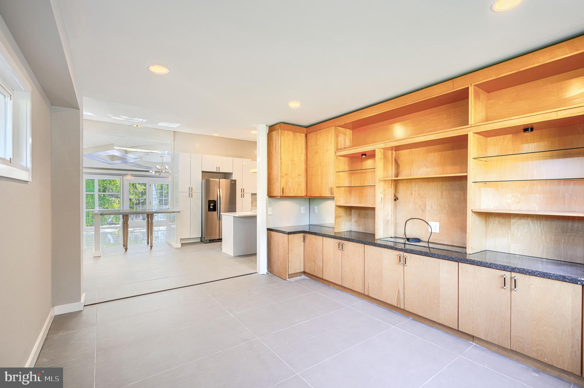 6200 Ivymount Road Baltimore, MD 21209 - Photo 22 of 71 a large white kitchen with a large window