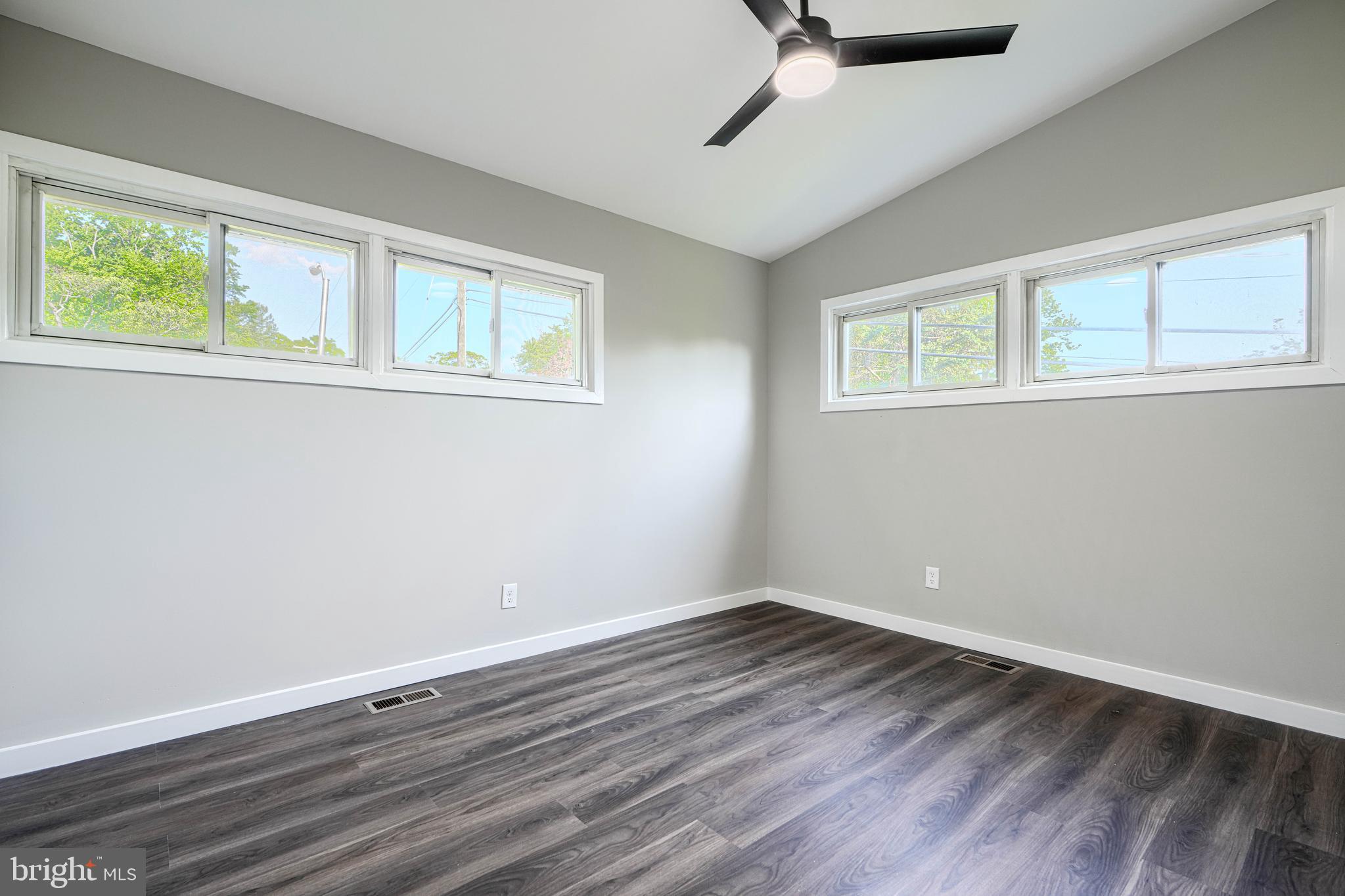6200 Ivymount Road Baltimore, MD 21209 - Photo 35 of 71 a view of a room with wooden floor and windows
