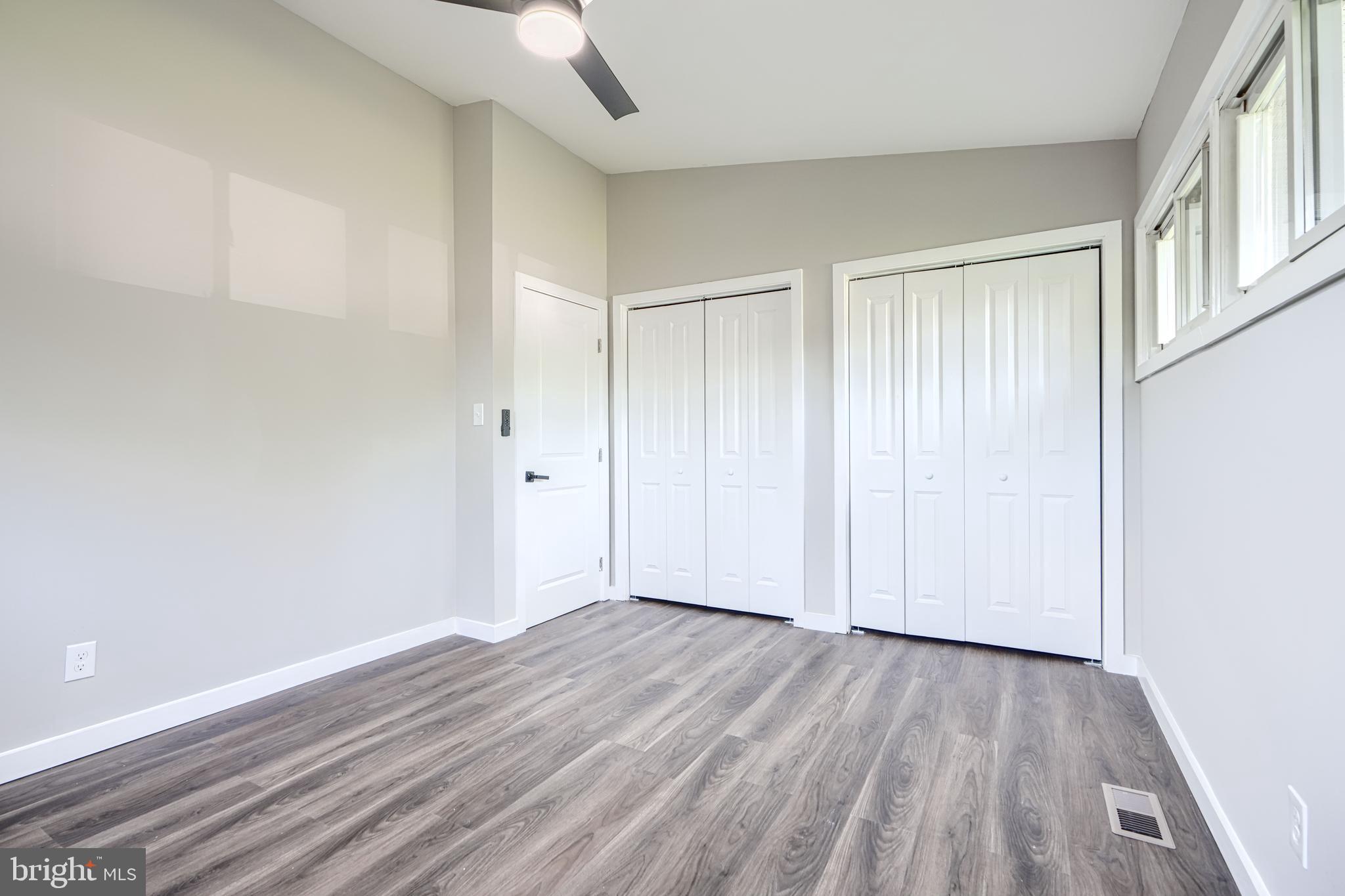 6200 Ivymount Road Baltimore, MD 21209 - Photo 36 of 71 a view of an empty room with wooden floor
