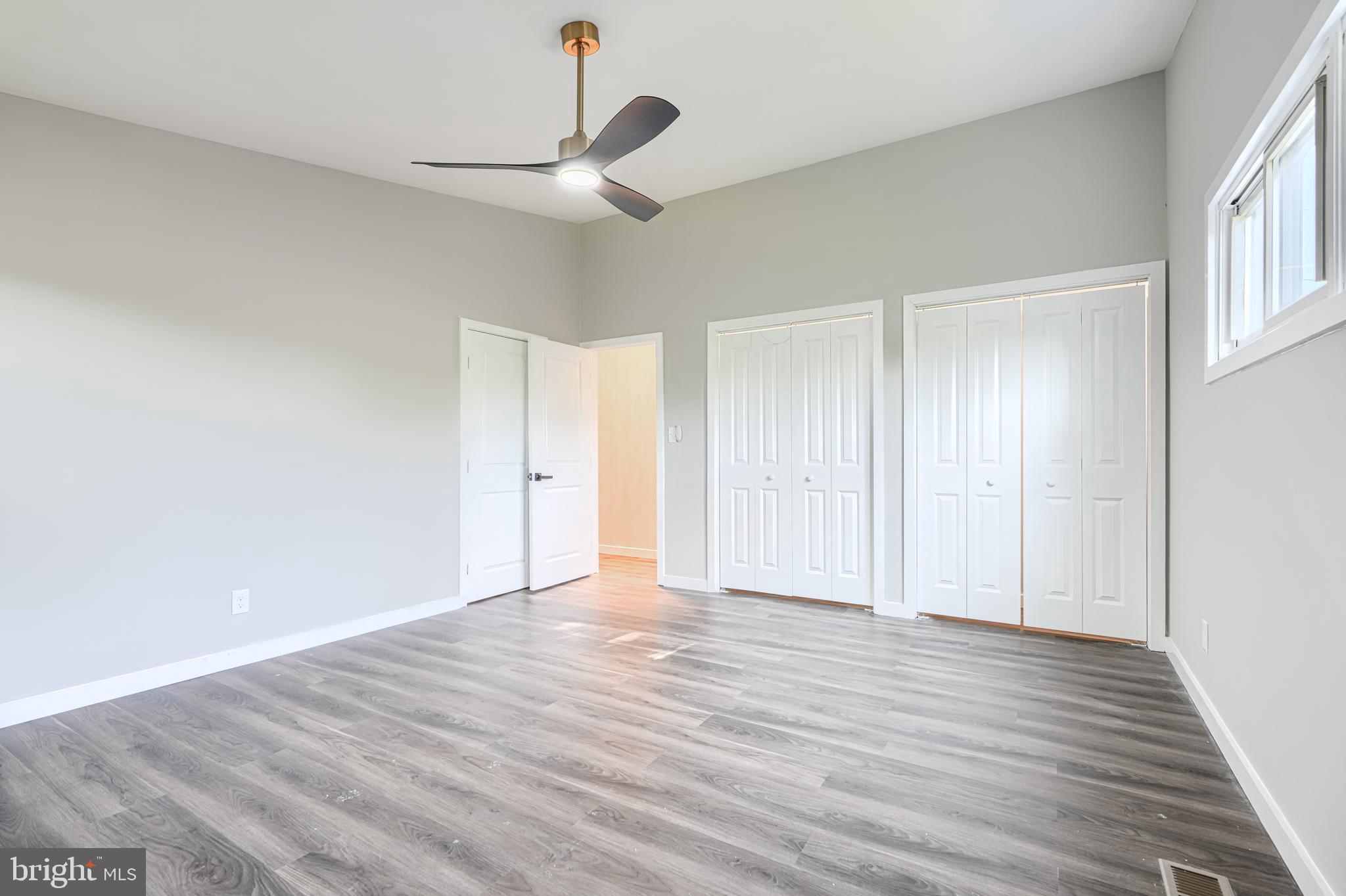 6200 Ivymount Road Baltimore, MD 21209 - Photo 39 of 71 a view of an empty room with wooden floor