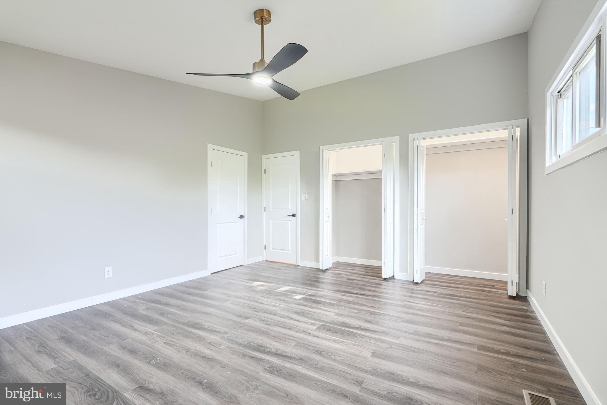6200 Ivymount Road Baltimore, MD 21209 - Photo 40 of 71 a view of an empty room with wooden floor