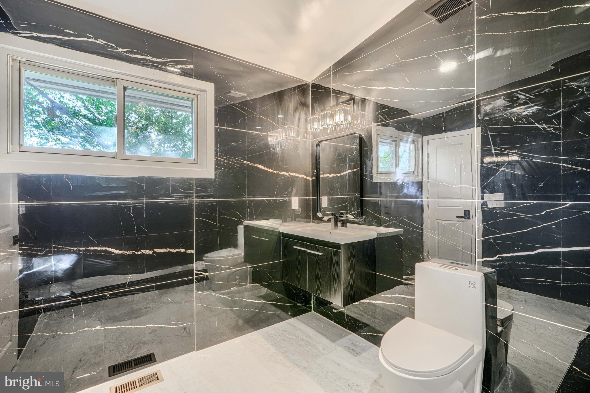 6200 Ivymount Road Baltimore, MD 21209 - Photo 45 of 71 a bathroom with a sink toilet and shower