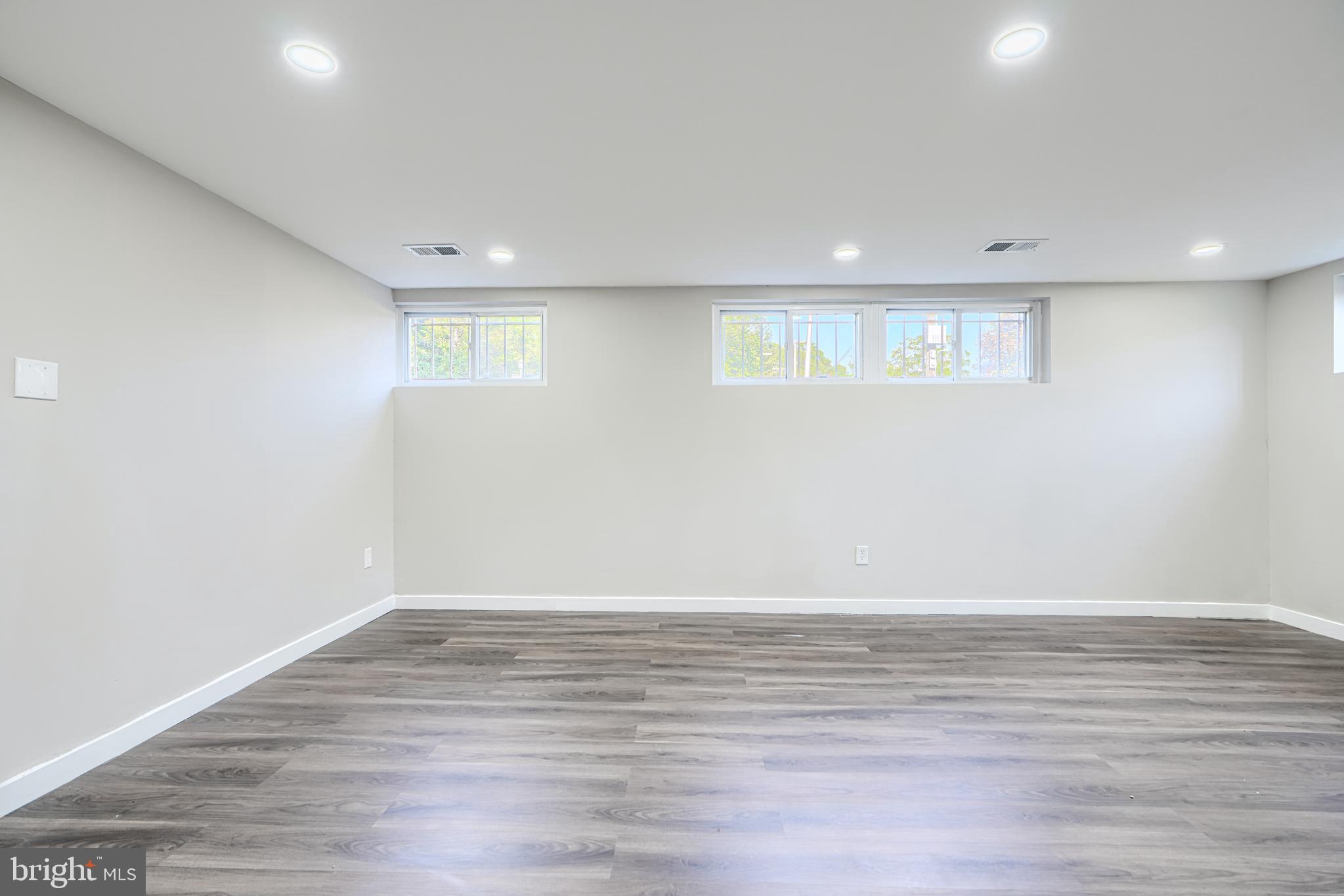 6200 Ivymount Road Baltimore, MD 21209 - Photo 55 of 71 a view of an empty room with wooden floor