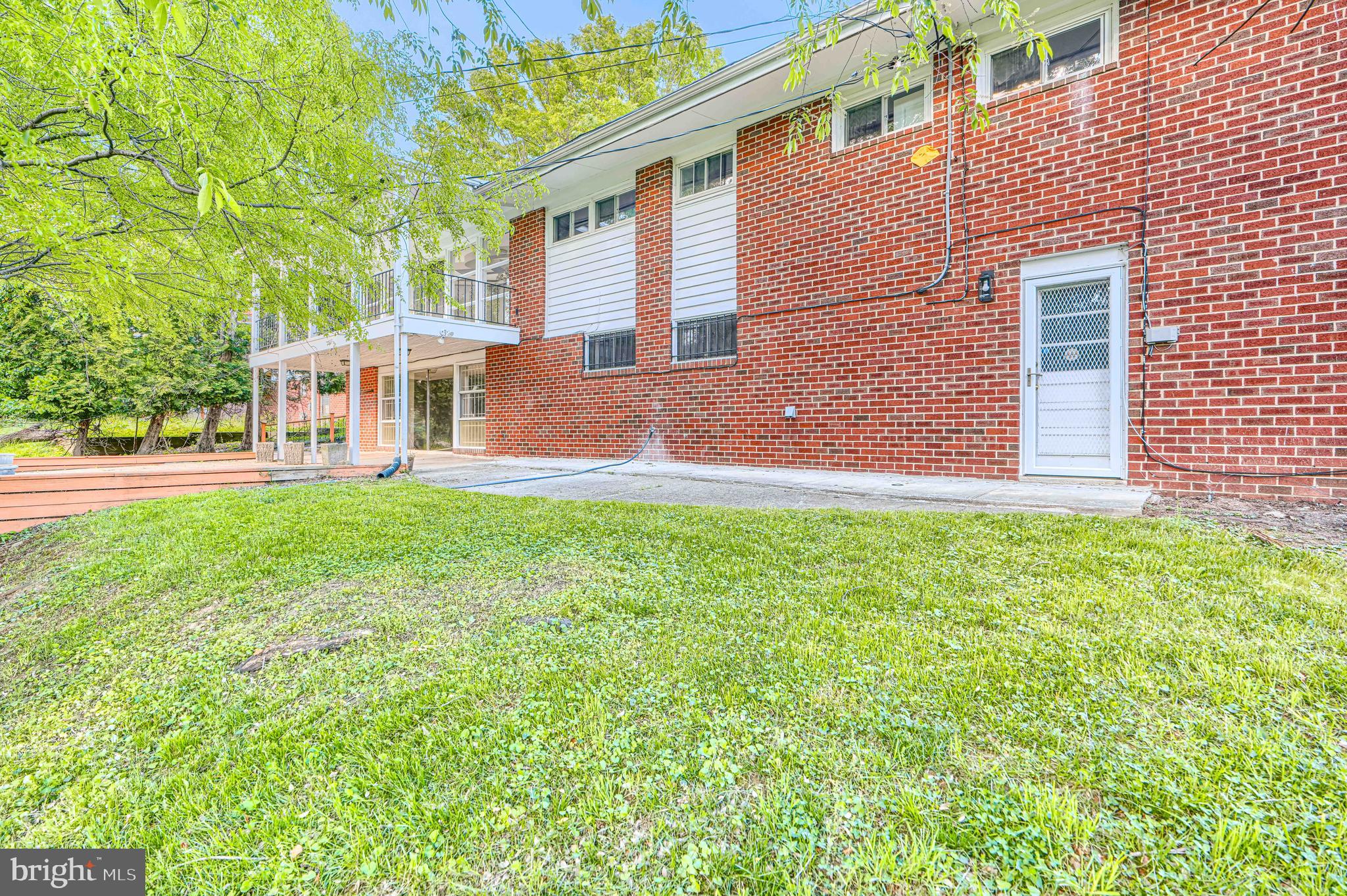 6200 Ivymount Road Baltimore, MD 21209 - Photo 69 of 71 a front view of a house with a yard and trees