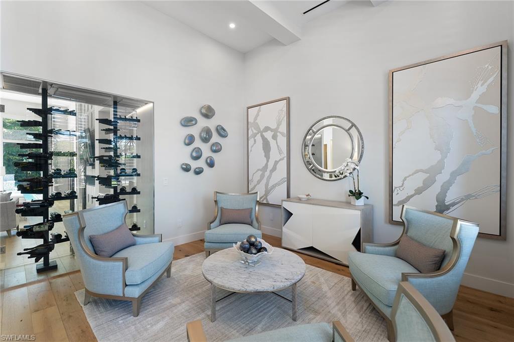 720 Orchid Drive Naples, FL 34102 - Photo 12 of 50 a living room with furniture and a large window