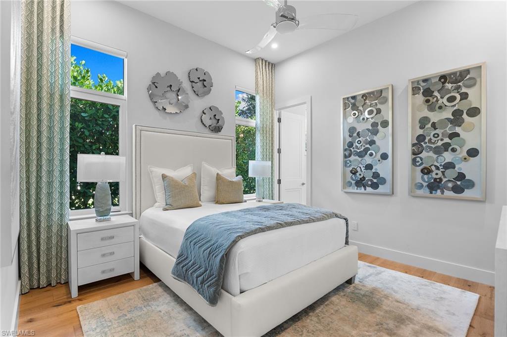 720 Orchid Drive Naples, FL 34102 - Photo 31 of 50 a bedroom with a large bed and a window