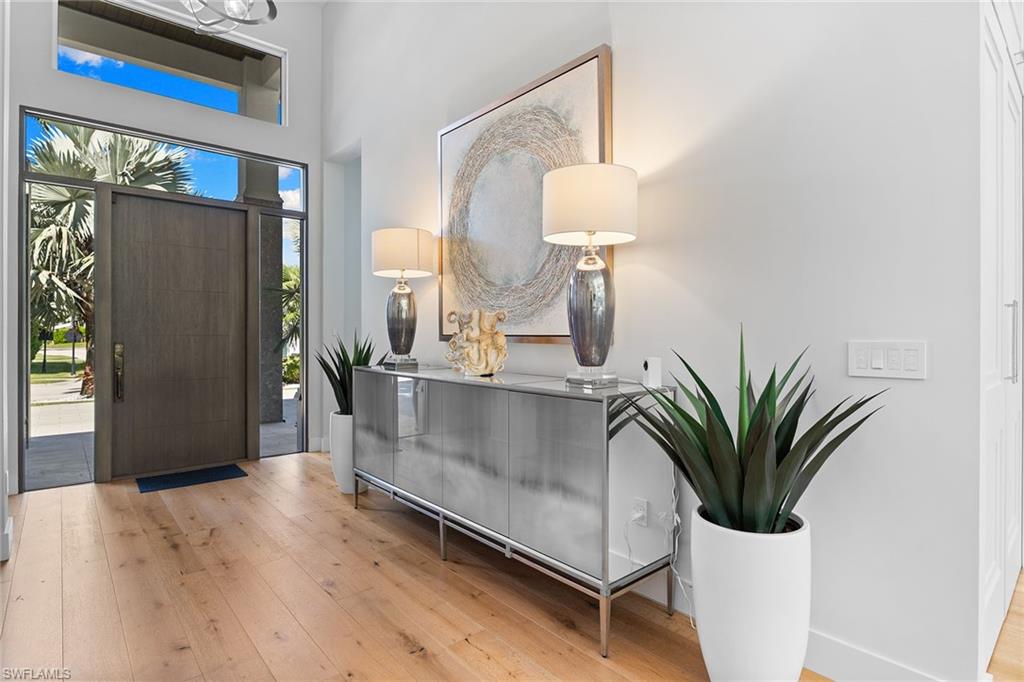 720 Orchid Drive Naples, FL 34102 - Photo 4 of 50 a view of living room with furniture and a potted plant