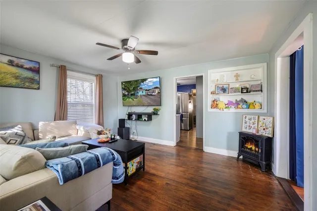 a bedroom with furniture and a wooden floor