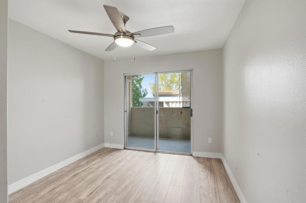 3435 Capalina Road, Unit 10 San Marcos, CA 92069 - Photo 12 of 34 wooden floor in an empty room with a window
