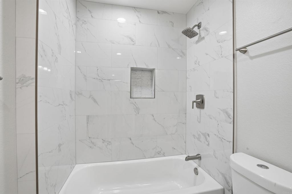 3435 Capalina Road, Unit 10 San Marcos, CA 92069 - Photo 13 of 34 a bathroom with a bathtub and a shower