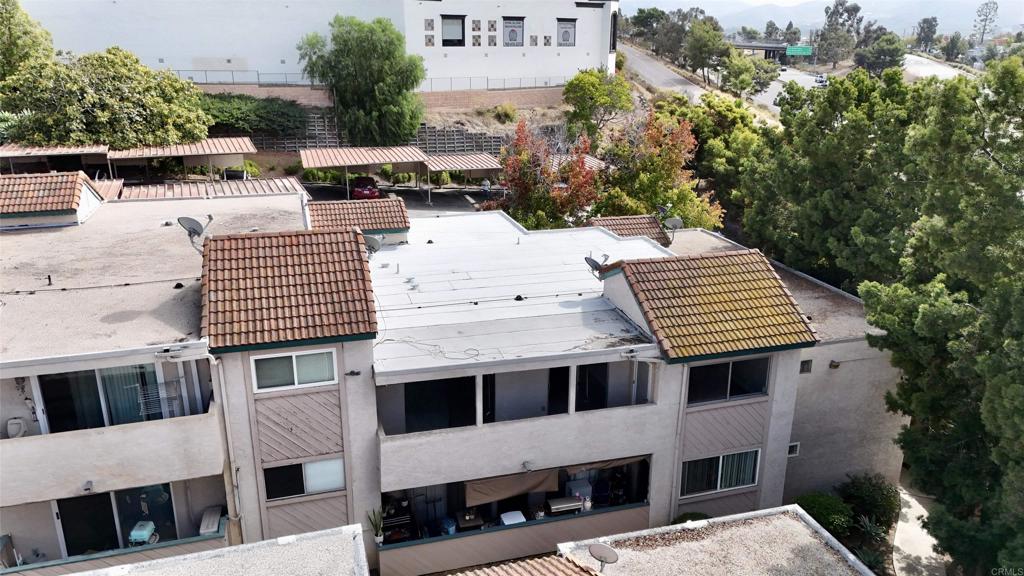 3435 Capalina Road, Unit 10 San Marcos, CA 92069 - Photo 33 of 34 a view of a patio with table and chairs and potted plants