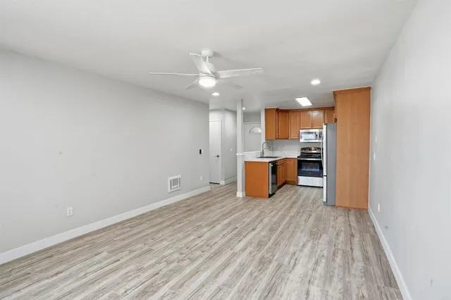 a view of kitchen with wooden floor