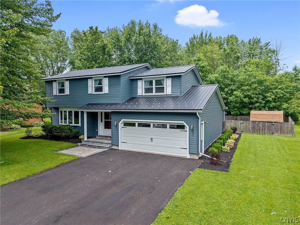 8069 Princess Path Clay, NY 13090 - Photo 44 of 50 Beautifully landscaped and trees beyond the fence,