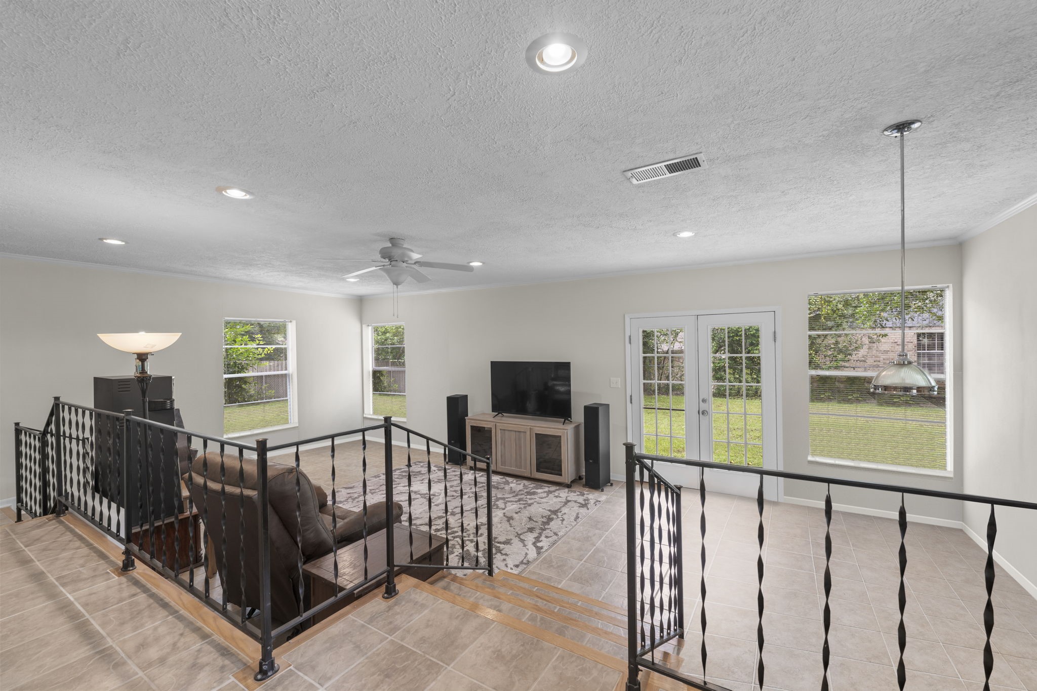 209 Summit Drive Conroe, TX 77303 - Photo 9 of 22 This open-concept living room features fresh paint throughout, a cozy gas fireplace, and a glimpse into the expansive 18x26 game room; perfect for entertaining.