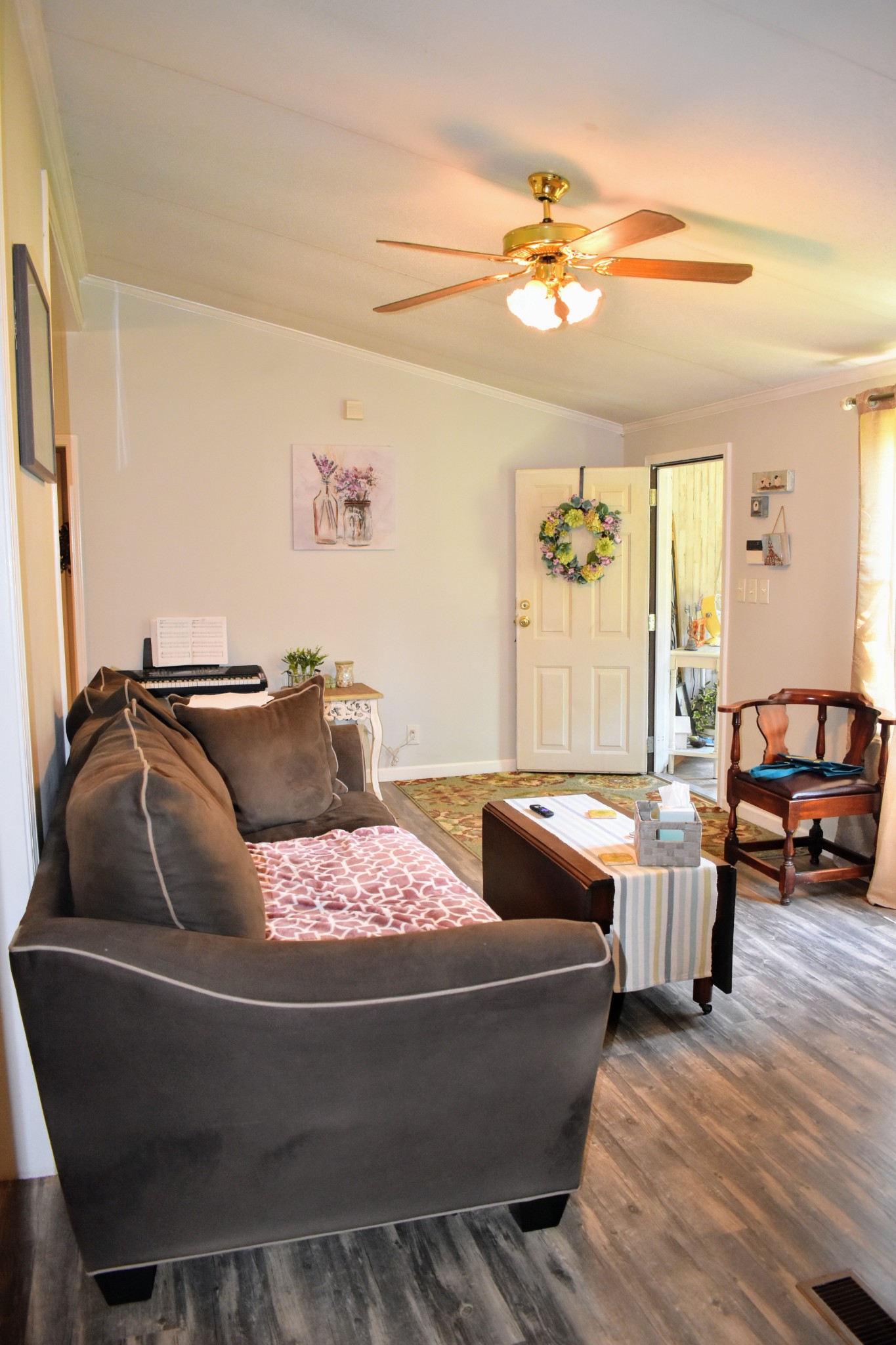 2630 Jernigans Branch Road Beechgrove, TN 37018 - Photo 6 of 17 a living room with furniture and a chandelier