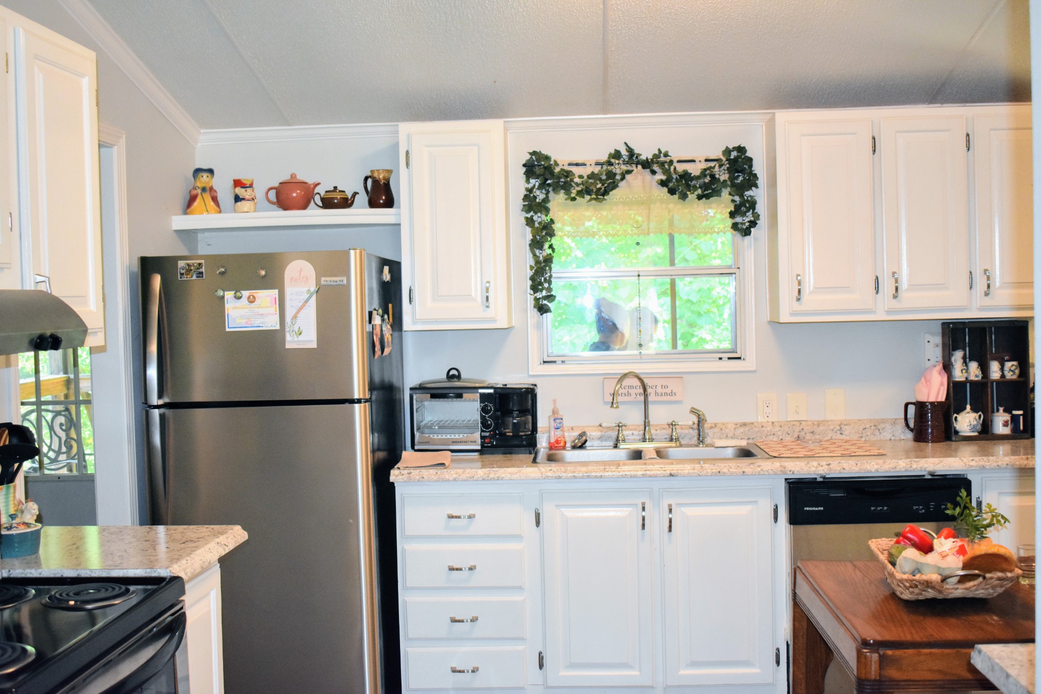 2630 Jernigans Branch Road Beechgrove, TN 37018 - Photo 10 of 17 a kitchen with refrigerator a stove a sink and a window